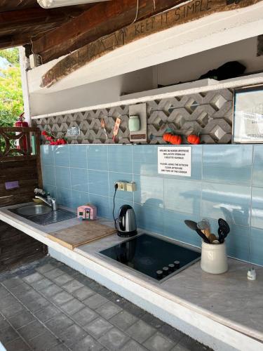 a kitchen with a sink and a counter top at Camp Mali Baška in Baška