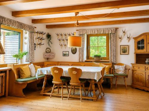 a dining room with a table and chairs at Landhaus Sisi - River&Pool in Bad Ischl
