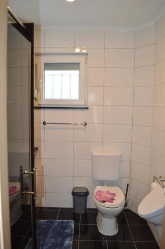 a bathroom with a toilet and a window at Marina in Čapljina