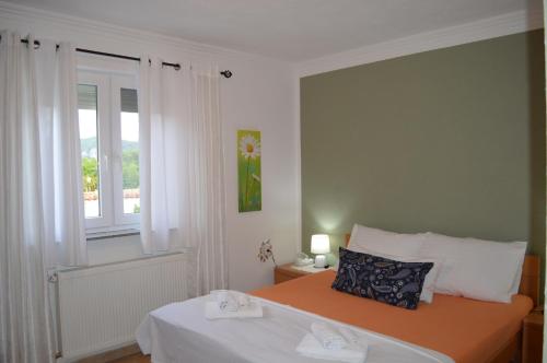a bedroom with a bed and a window at Marina in Čapljina