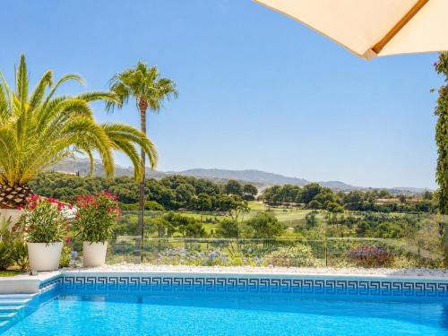 a villa with a pool and a view at Aurora Boutique - Only Adults in Marbella