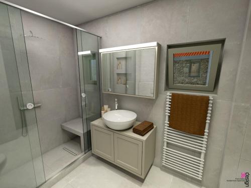 a bathroom with a sink and a shower at The Prοfessοrs House - Myrina 1922 in Myrina