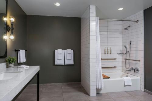 a bathroom with a shower and a bath tub at Marriott Vacation Club®, San Francisco   in San Francisco