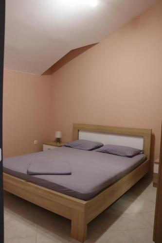 a bedroom with a bed in a room at Aurora Residence in Nalježići