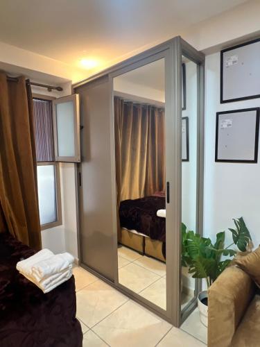 a room with a sliding glass door leading to a bedroom at Modern Studio in Kenitra