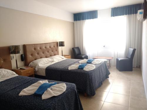 Ένα ή περισσότερα κρεβάτια σε δωμάτιο στο Hotel Gladiador