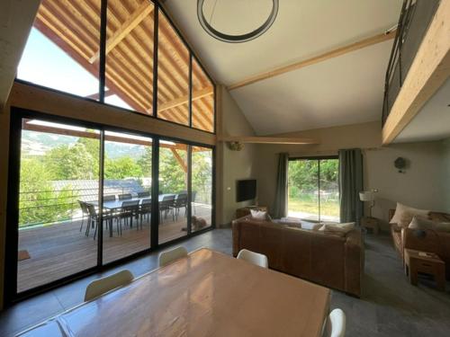 a living room with a couch and a table at le chalet de st Anne in Jausiers