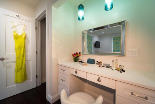 a bathroom with a sink and a mirror at The Newport Lofts - 617 Thames Street in Newport