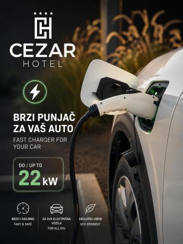 a electric car is being charged by a charger at Hotel Cezar Banja Luka in Banja Luka