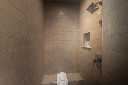 a bathroom with a shower with a toilet in it at The Newport Lofts - 611 Thames Street in Newport