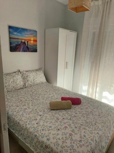 a bedroom with a bed with two pillows on it at Velvet in Perea