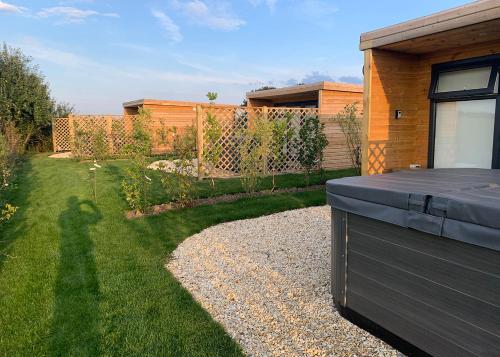 a backyard with a house and a garden at Fine Country Stays in Bubwith