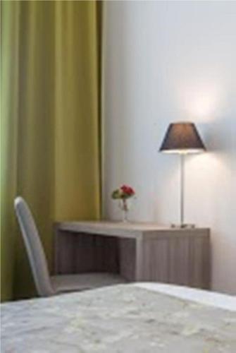 Katil atau katil-katil dalam bilik di Hôtel Atlantic