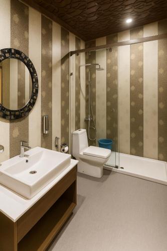 a bathroom with a sink and a toilet and a shower at HAYAT Group OF Houseboats in Srinagar