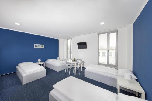 Postel nebo postele na pokoji v ubytování Hotel & Hostel Letov