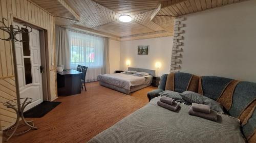 a living room with a couch and a bed at Hollywood in Yaremche