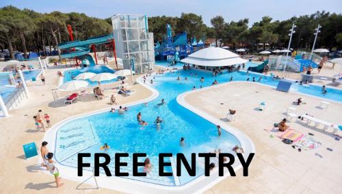 a group of people in a pool at a water park at VELA Glamping - Camp Čikat - Lošinj in Mali Lošinj