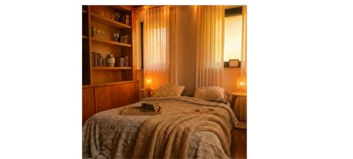 a bedroom with a bed and a book shelf at die perfekte Auszeit in Illingen