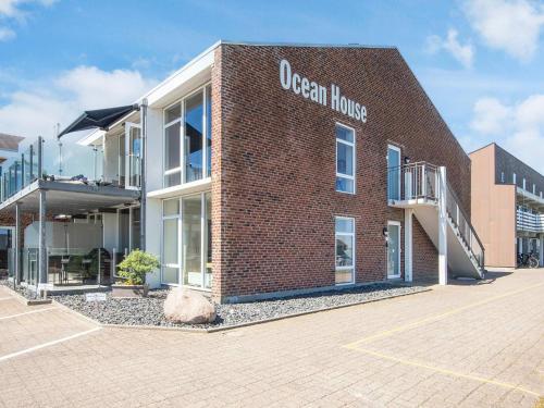 a red brick building with the words ocean house on it at 5 star holiday home in Ringkøbing in Ringkøbing