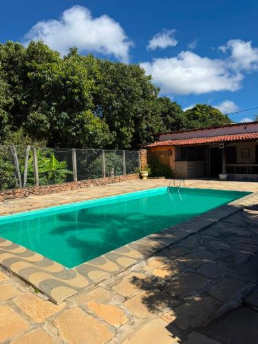 a swimming pool in the backyard of a house at Pousada e Camping Sá Zabé in Rio de Contas