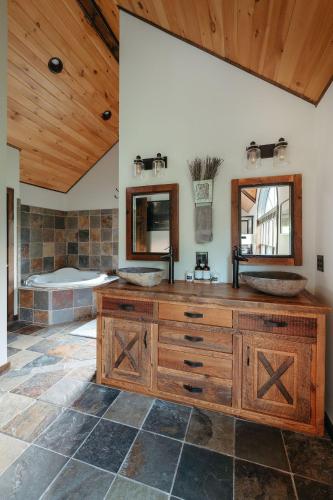 a bathroom with two sinks and a tub at Red Tara Sanctuary in Catskill