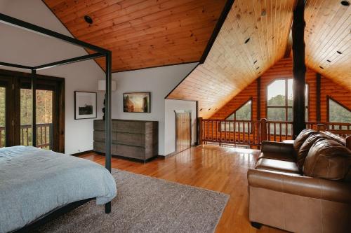 a bedroom with a bed and a couch at Red Tara Sanctuary in Catskill