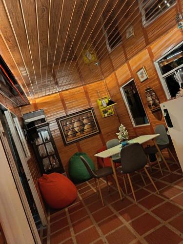 a room with a table and chairs in a house at Altos de Shalem casa canaan in Anolaima