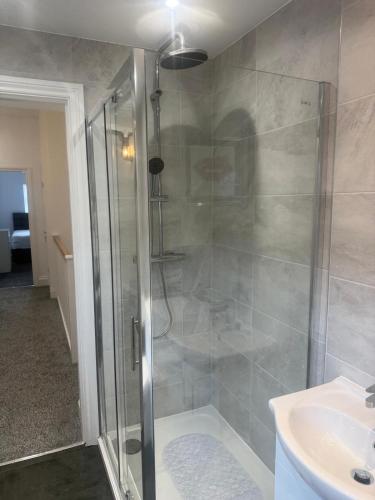 a bathroom with a shower and a sink at Nest in Northumberland 2 in Blythe