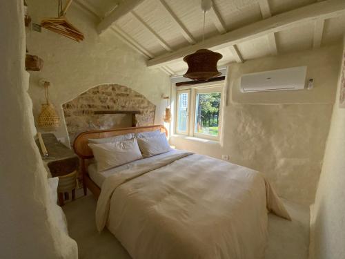 a bedroom with a bed and a window at Monte Pino in Pergola