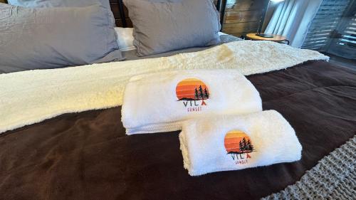 a bed with two towels on top of it at Forest in Domingos Martins