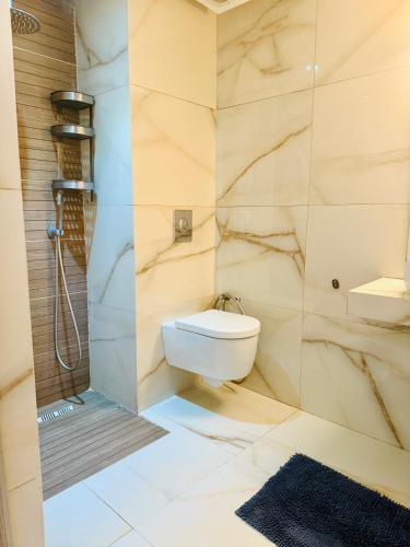 a bathroom with a sink and a toilet and a shower at Islane Holiday Studio with pool&balcony in Agadir