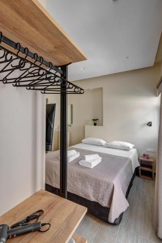 a bedroom with a large bed in a room at Syranna in Ermoupoli