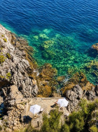 an aerial view of the water on a cliff at Villa Cliff in Aspra
