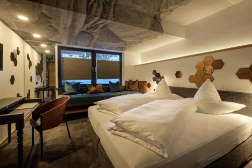 Postel nebo postele na pokoji v ubytování Boutique Hotel Gams