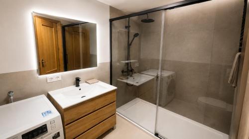 a bathroom with a shower and a sink and a toilet at Casanova in Calpe