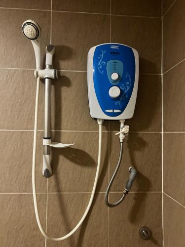 a soap dispenser on the wall of a bathroom at Tiara Homestay Desaru - Nature view in Bandar Penawar