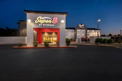 a building with a sign that reads super by convention at Super 8 by Wyndham Mesa Gilbert in Mesa