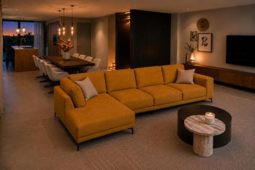 a living room with a couch and a table at De Duyn in Midsland