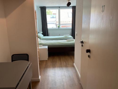a room with a window and a room with a bed at Apartment Altstadt Stralsund in Stralsund