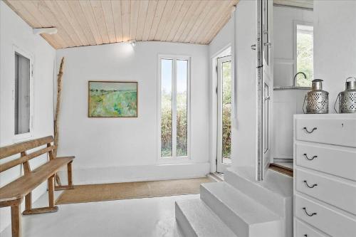 a hallway with white walls and a wooden ceiling at 30001-Malling-Hasselvaenget-7 in Malling