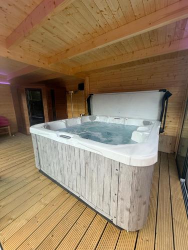 a large jacuzzi tub in a room at L'Aurore Céleste in Aywaille
