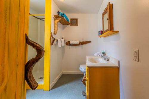 a bathroom with a sink and a toilet at Woods End Landing in Bamfield