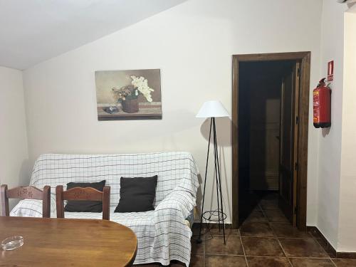 a living room with a couch and a table at Esencia plaza in Hornos