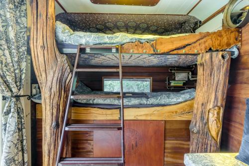 a room with two bunk beds and a ladder at 1 Bed in Elsing oc-d44229 in Elsing