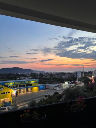 a sunset view from a window of a building at Apartment by Bar in Bar