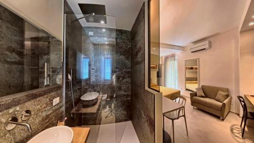 a bathroom with a shower and a sink in a room at Tornola Luxury Rooms in Termoli