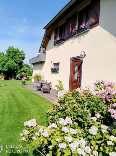 a house with flowers in front of it at JustB in Riemst