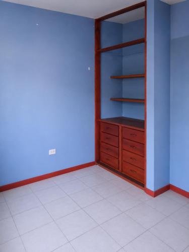 a empty room with a cabinet and a tiled floor at Nau Guest House & Restaurant in Iquitos