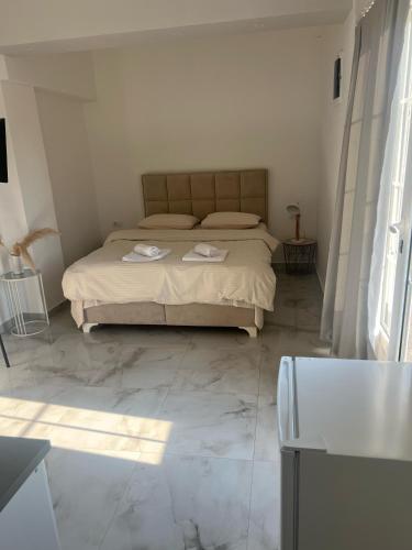 a bedroom with a bed with two towels on it at Studio Apartment Vukcevic 3 in Golubovci