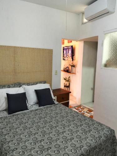 a bedroom with a large bed in a room at departamento bugambilias in Tepic
